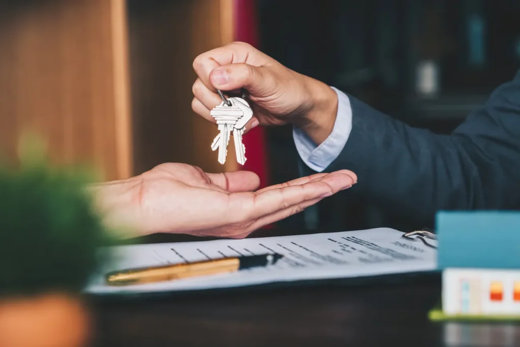 Keys changing hands over document