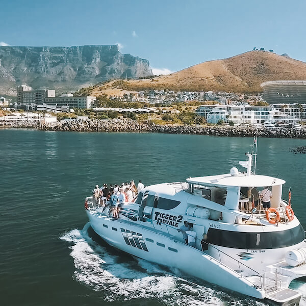 boat cruising in Cape Town harbor with Table Mountain in the background